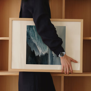 Framed minimalist artwork of a moody black bay. Purchase print for a chance to win a Tudor Black Bay 54.