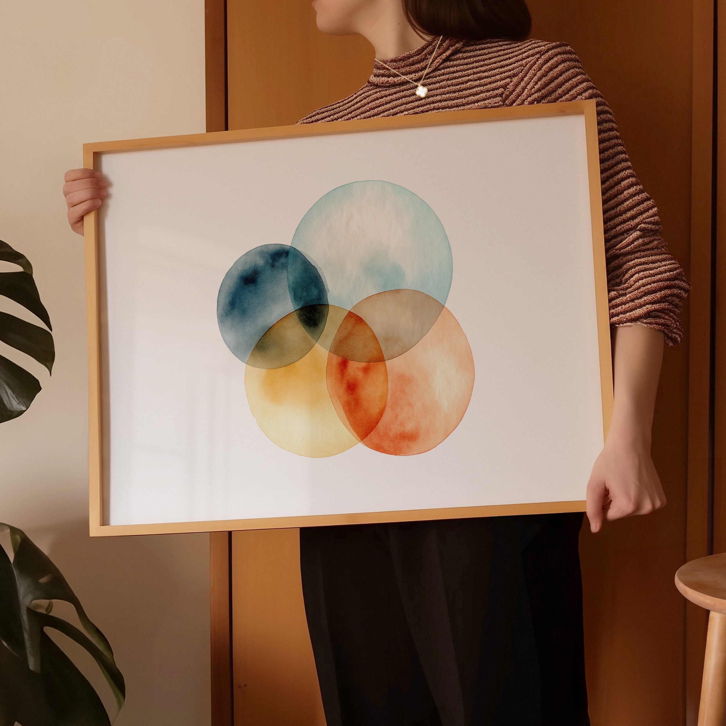 Framed abstract art with colorful circles. Purchase for a chance to win a gold Van Cleef & Arpels Sweet Alhambra necklace.