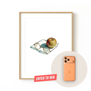 Framed print of Steve Jobs-inspired glasses in front of a red apple. Purchase for a chance to win an Apple iPhone 17 Pro.