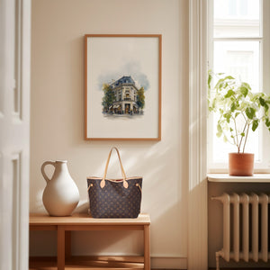 Framed print of a parisian Haussmann building on a corner block. Purchase for a chance to win a Louis Vuitton Neverfull.
