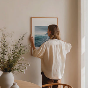 Framed minimalist artwork of a moody black bay. Purchase print for a chance to win a Tudor Black Bay 54.
