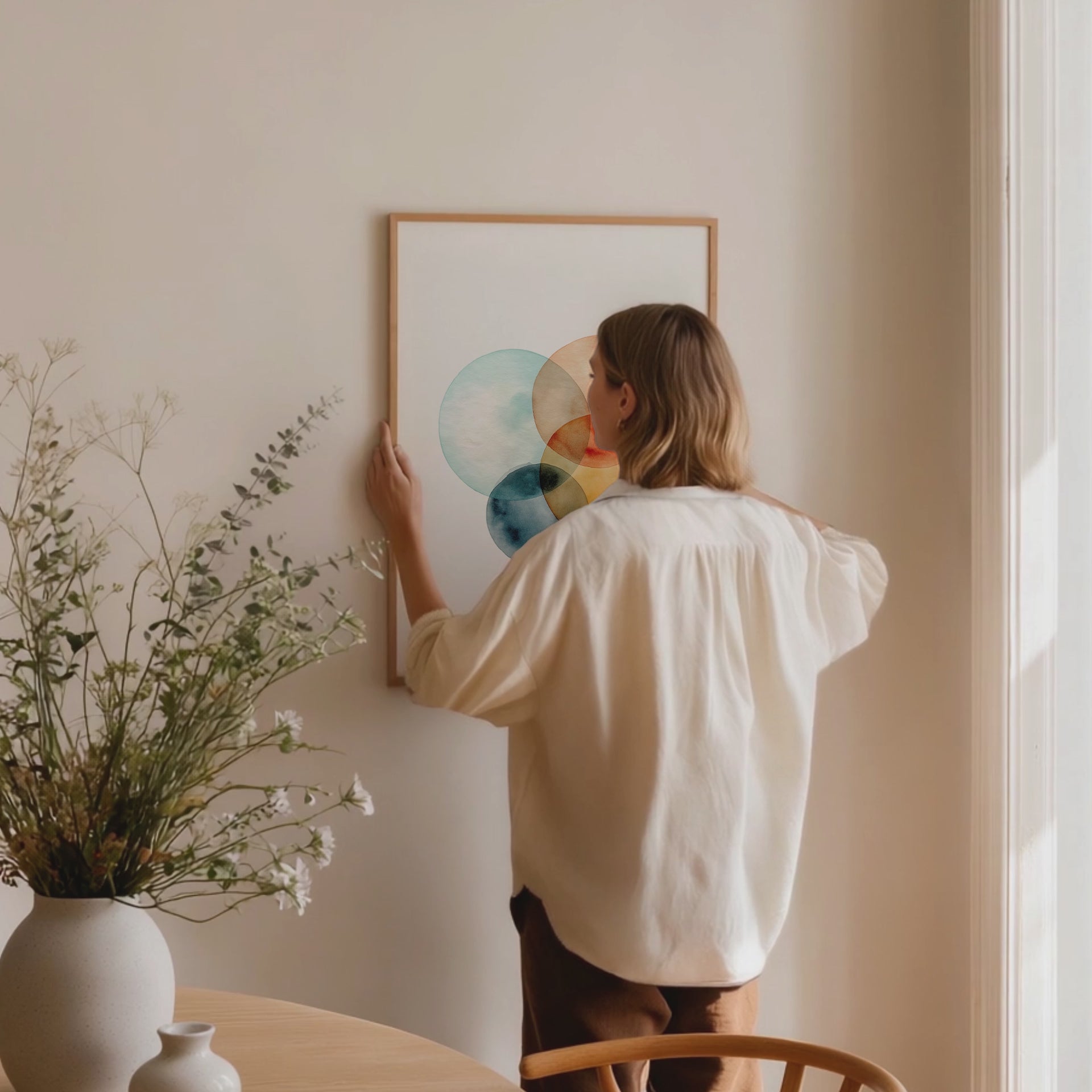 Framed abstract art with colorful circles. Purchase for a chance to win a gold Van Cleef & Arpels Sweet Alhambra necklace.